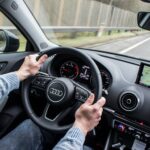 man driving a car
