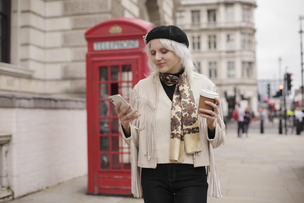 Woman in front of a phone boot