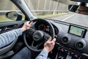 man driving a car