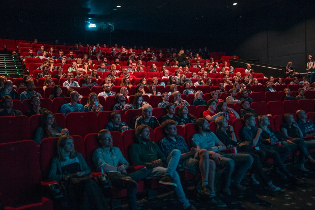 people in the cinema watching a movie